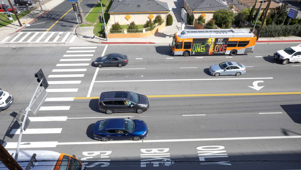 LA Metro buses traveling in dedicated bus lanes.