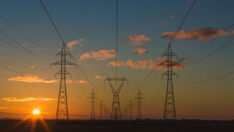 power lines set against a sunset