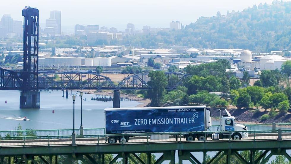 ConMet powered trailer crossing a bridge.
