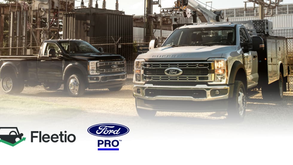 An image of two work trucks on site with a Fleetio and Ford Pro logo.
