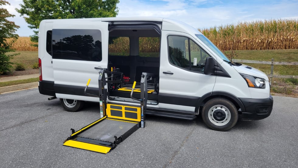 A white van with a chair lift conversion.