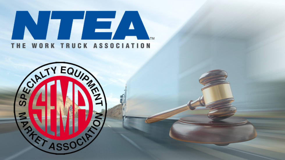 Image of truck with association logos and gavel