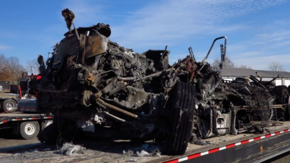 Remains of burned-up Freightliner tractor-trailer