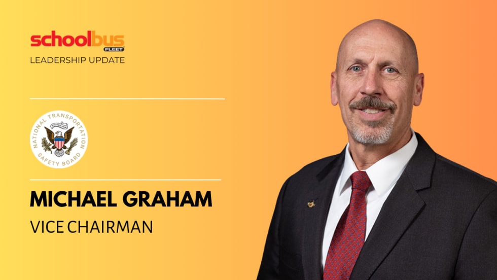 Graphic featuring a headshot of Michael Graham, Vice Chairman of the National Transportation Safety Board, wearing a dark suit and red tie against an orange gradient background, with “Leadership Update” and School Bus Fleet branding on the left.