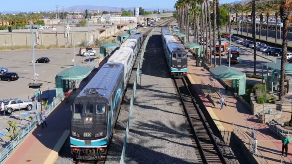 A Metrolink station with two trains.