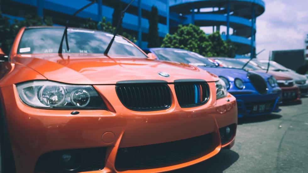 Photo of line of new cars on a lot