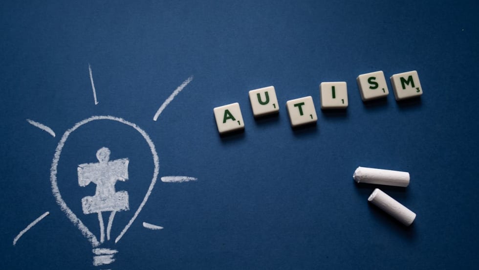 Scrabble Tiles and Chalk on Blue Background