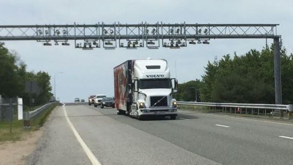 A truck passes under a toll gantry on the first day of Rhode Island's truck-only tolls in 2018