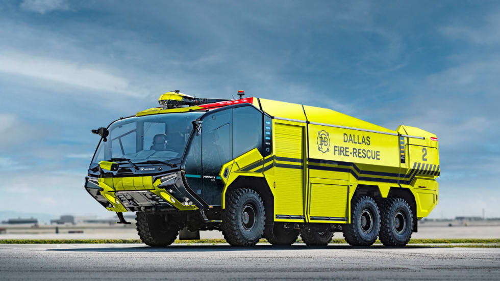 A bright yellow aircraft rescue firefighting truck is shown.