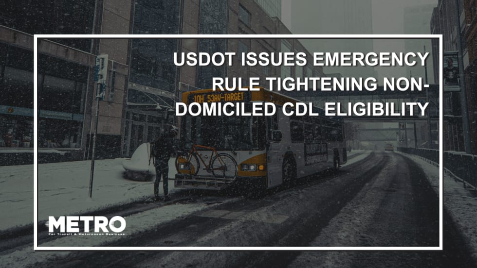 A graphic with an image of a public transit bus on a snowy city road and text reading "USDOT Issues Emergency Rule Tightening Non-Domiciled CDL Eligibility."