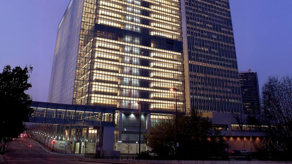 Photo of a big beautiful tall building in downtown Tulsa at sunset. 