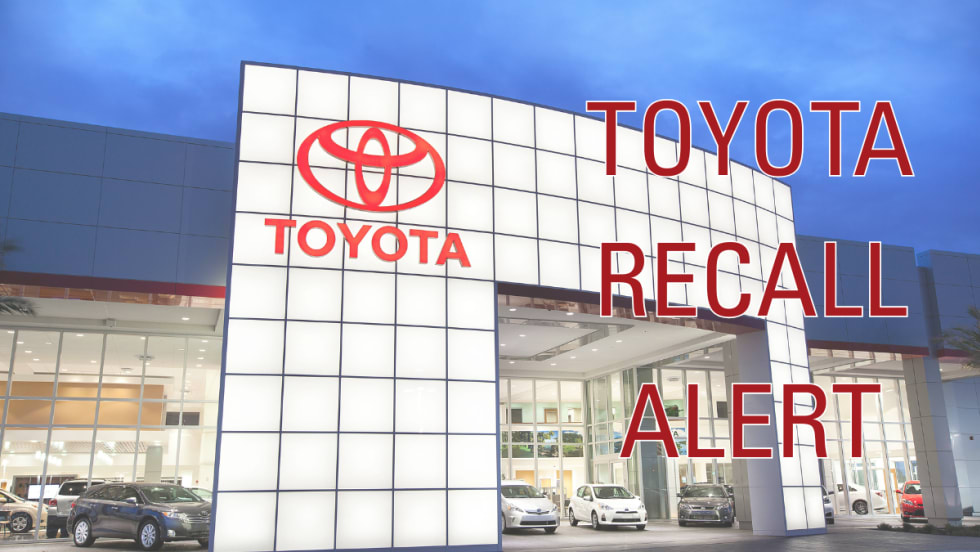 A picture of a Toyota dealer and the words "TOYOTA RECALL ALERT" across the front of the picture.