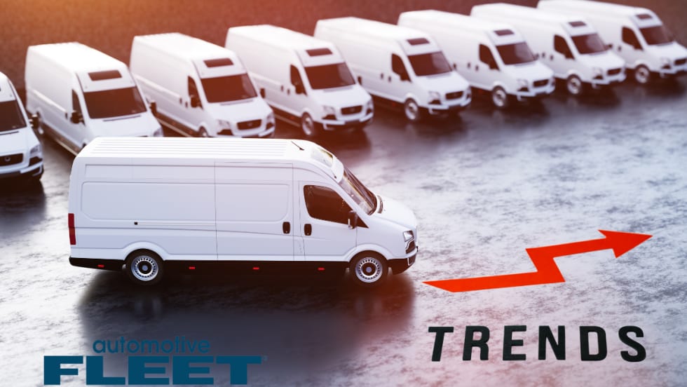 white commercial vans with an arrow indicating upward trend.