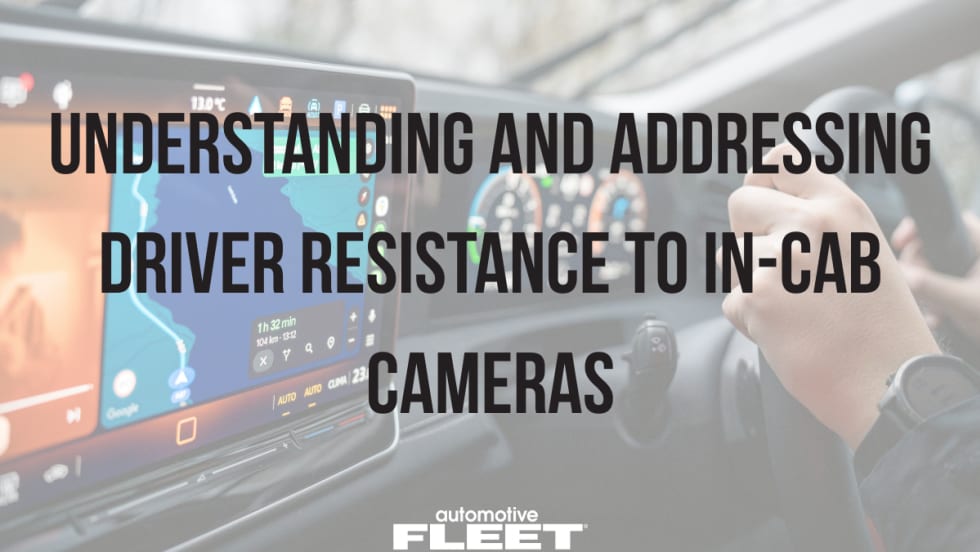 Driver holding steering wheel with dashboard navigation screen visible, overlaid with text about in-cab cameras and driver resistance in fleet safety technology.