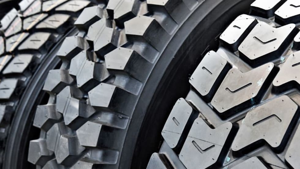 Closeup of truck tire treads.