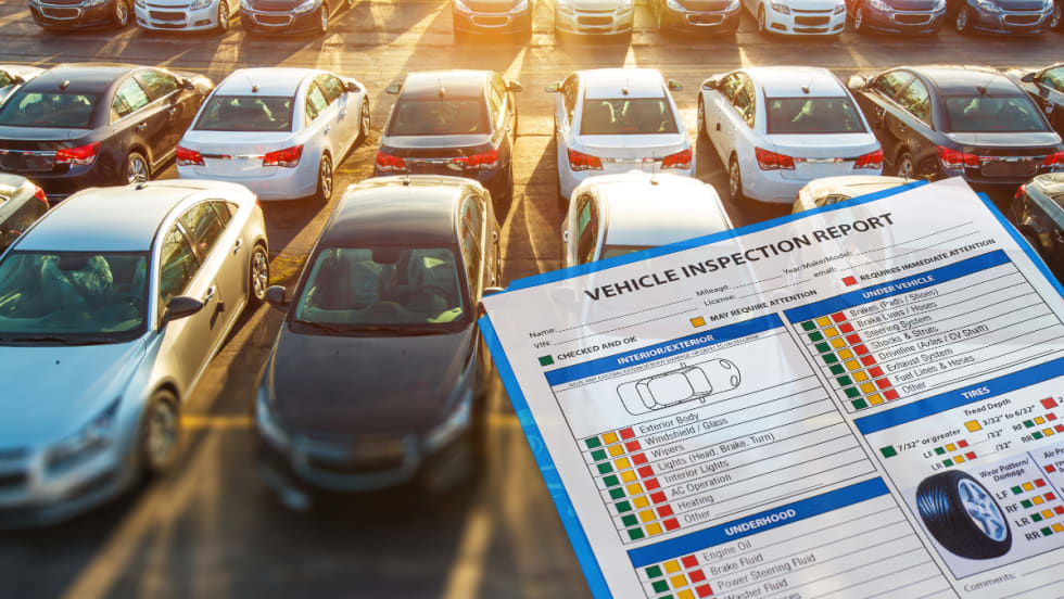 vehicles in parking lot with clipboard overlaid.