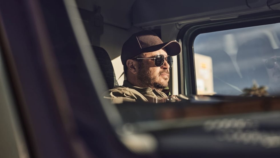Trucker driving a Volvo VNL.