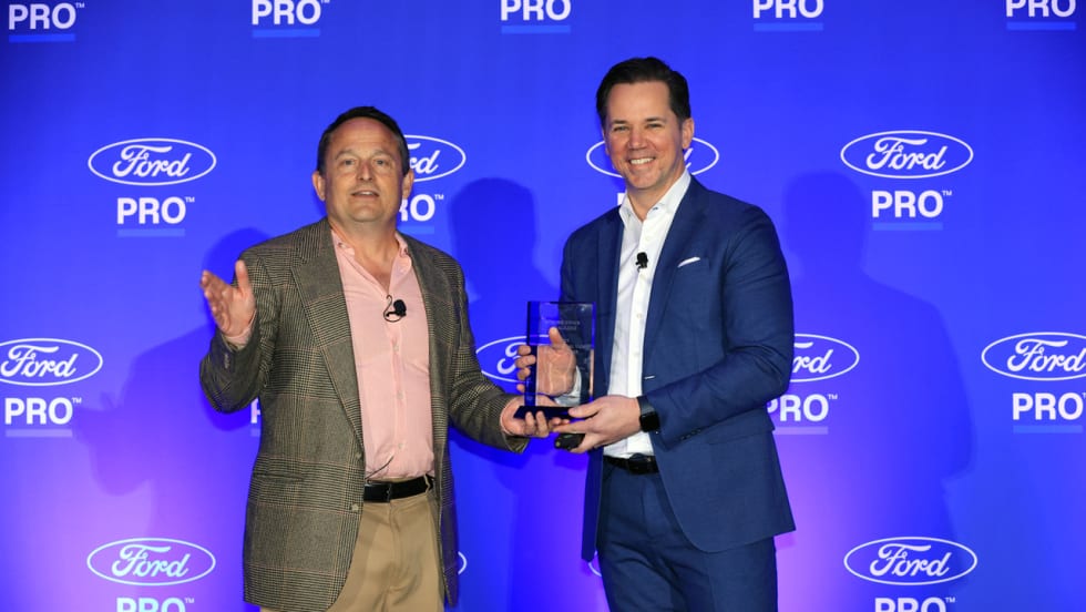 Chris Brown and Matt Atkenson of Ford Pro for Commercial Van of the Year at Work Truck Week
