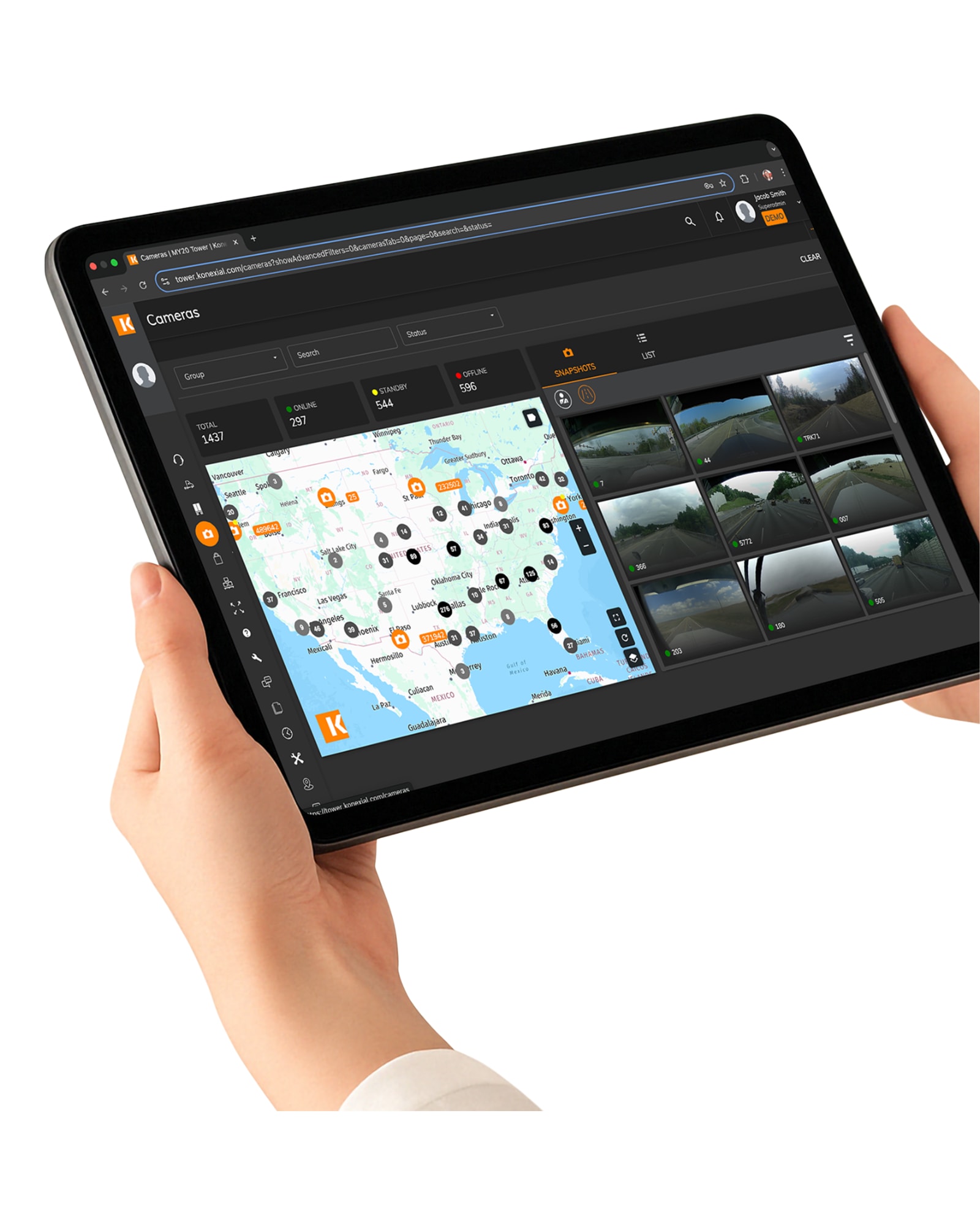 Tablet displaying a live map with multiple camera icons and real-time surveillance feeds - remote security monitoring interface for fleet and site management.