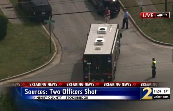 Two Georgia Officers Shot, Gunman Barricaded in Home
