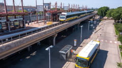 A DART railcar and bus.