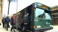 Passengers boarding a PRT bus
