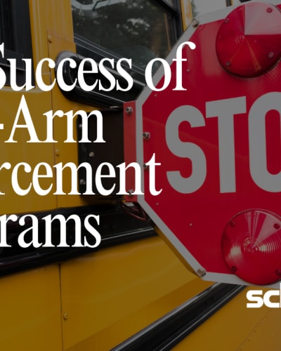 photo of a school bus stop sign and text next to it that reads "the success of stop-arm enforcement programs"