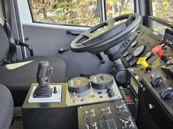 Interior cabin view of Monterra 6x6 looking out driver door