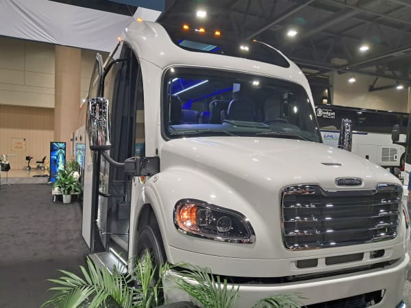 Executive Coachbuilders vehicle on UMA Expo show floor.