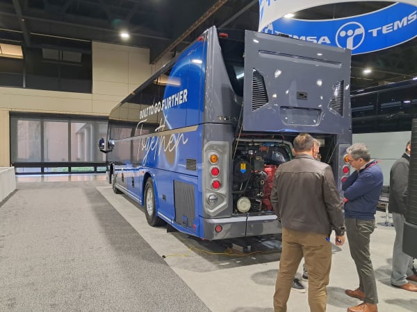 People talking in Temsa booth at UMA Expo 2026.