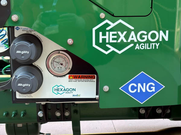 Closeup of Hexagon Agility CNG logo and fueling system