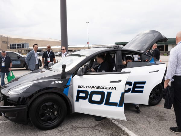 A Tesla Model 3 with a South Pasadena Police decal is shown.