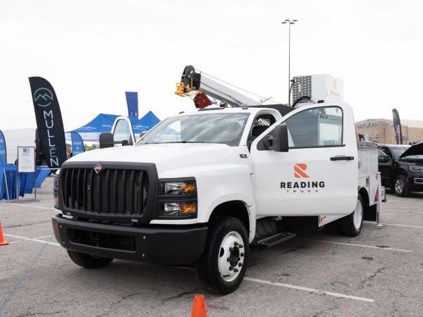 An International CV day cab truck with a Reading Truck service body and Stellar 7621 hydraulic service crane is on display in the Vehicle Showcase lineup.
