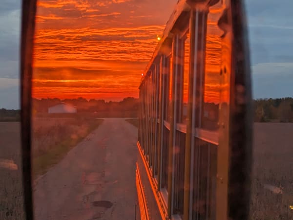 School bus rear view sunset