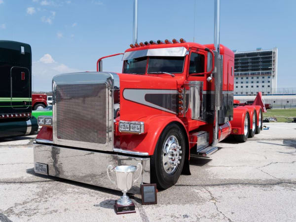 A red 2019 Peterbilt Model 390.