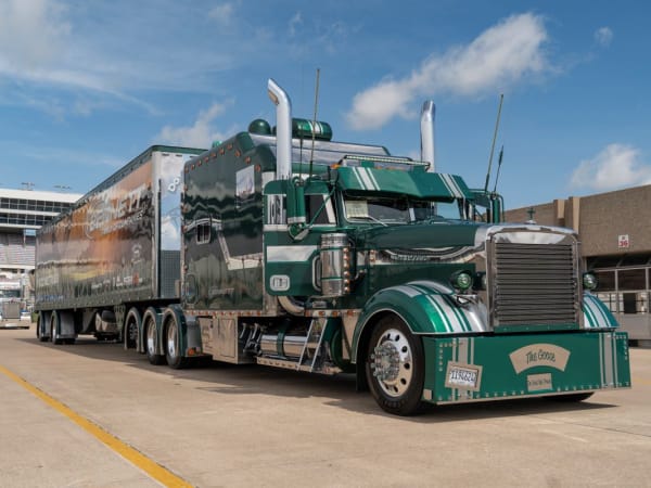 Green 1996 Freightliner Classic XL tractor-trailer.