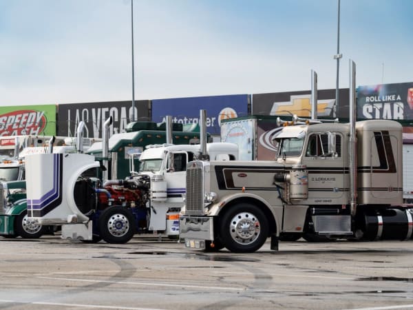 A lineup of show trucks at the Texas Motor Speedway.
