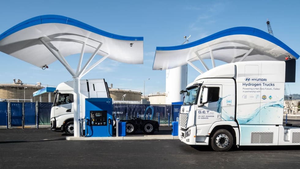 Hyundai Xcient Class 8 Fuel Cell Electric Trucks at hydrogen fueling station.