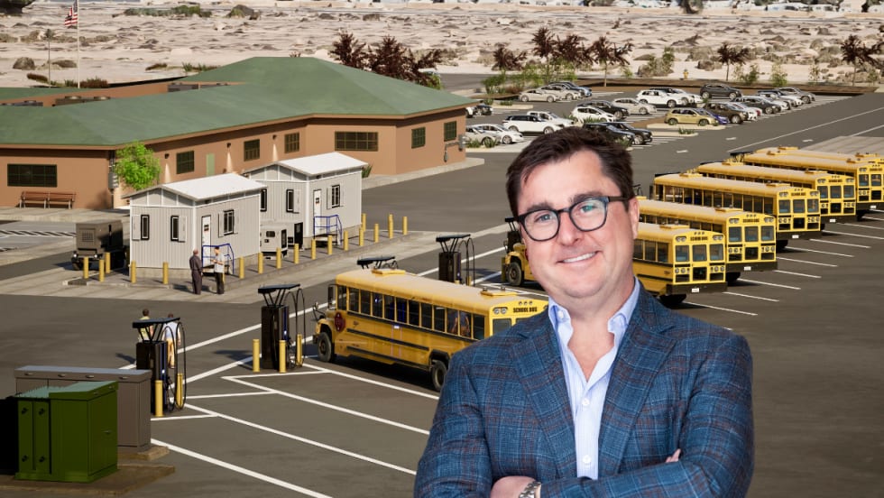 Matt Curwood in front of fleet of electric school buses.