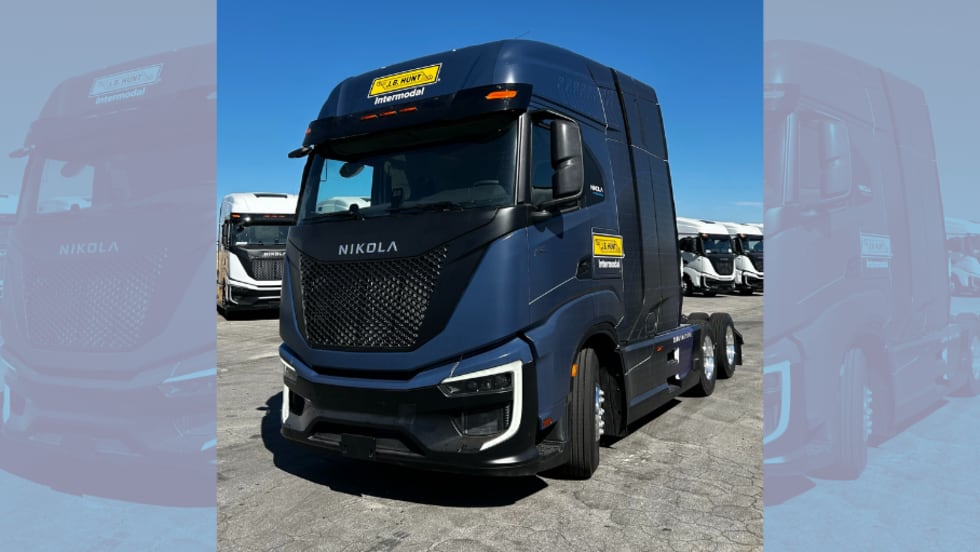 Dark blue European-style cabover tractor with J.B. Hunt logo