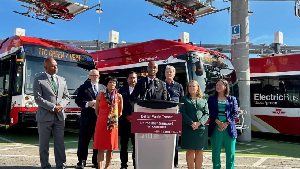 Toronto Transit Commission members unveiling new electric buses.