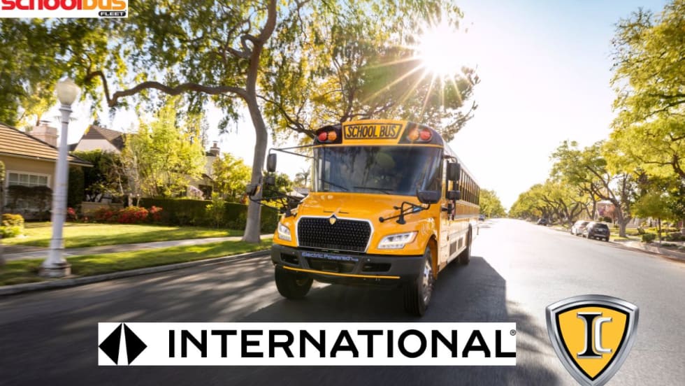 International's new logo in front of an IC bus driving down the road.