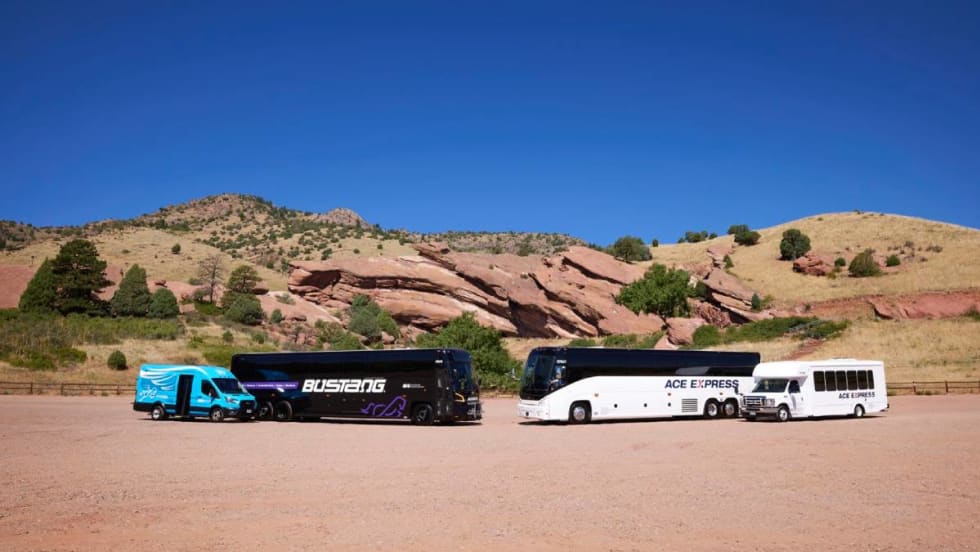 A Bustang and ACE Express motorcoach in front of a mountain