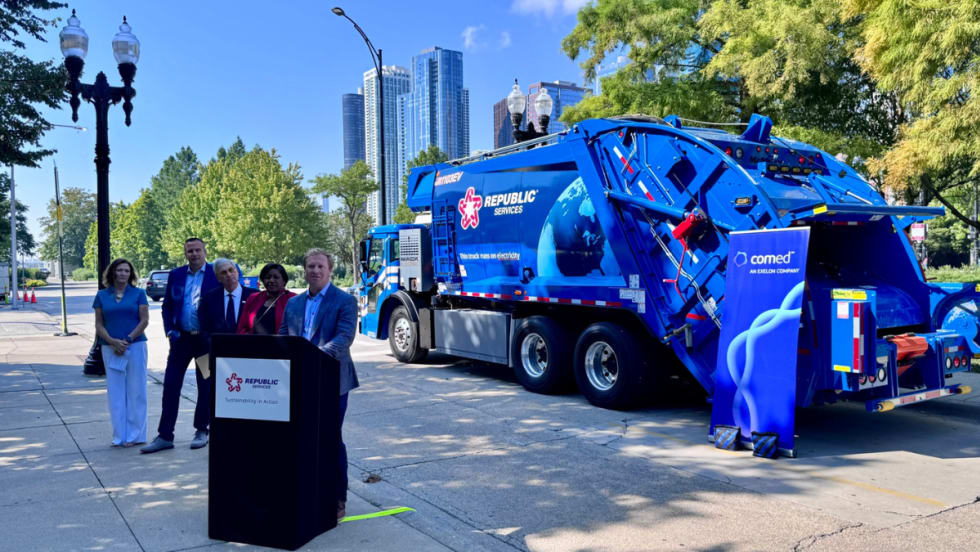 Speakers stand in front of Republic Services’ new Mack LR Electric refuse truck at a Chicago launch event with ComEd and Mack Trucks.