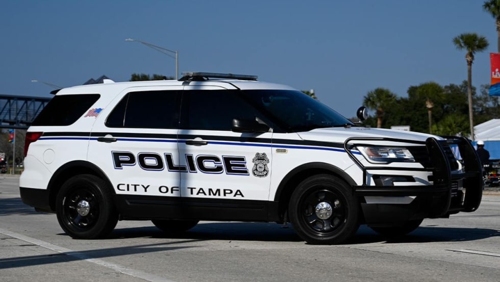 White City of Tampa police SUV parked on street with palm trees