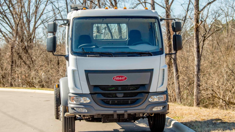 Interior view of a Peterbilt Model 220 cab featuring Fontaine’s dual-drive steering setup with two steering wheels—one on the left and one on the right side of the cab.