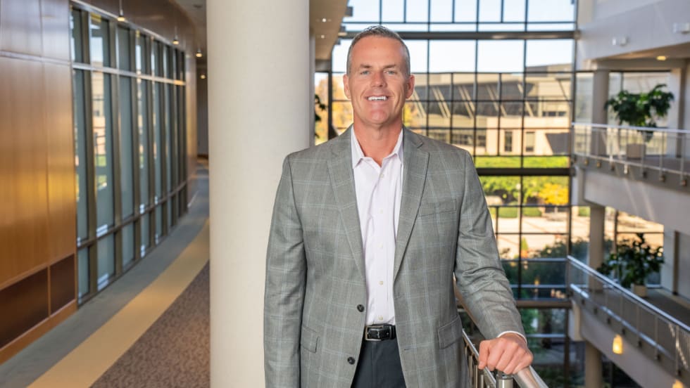 Shawn Concannon, president of TSD Mobility Solutions, stands inside a modern office building, representing TSD’s continued growth in connected-fleet technology.
