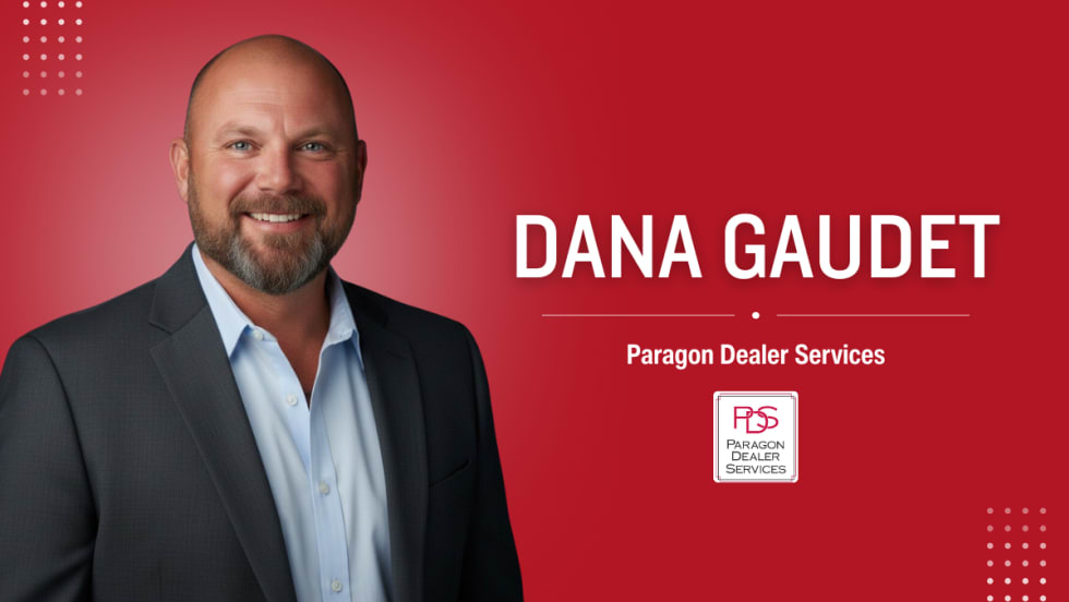 Portrait of Dana Gaudet, the new controlling owner of Paragon Dealer Services, standing in front of a red background with the company’s logo.