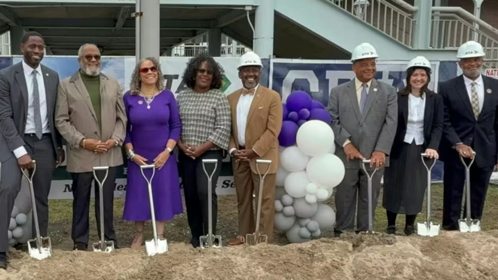 RTA and local officials in hard hats hold shovels at the Algiers Ferry Terminal groundbreaking.
