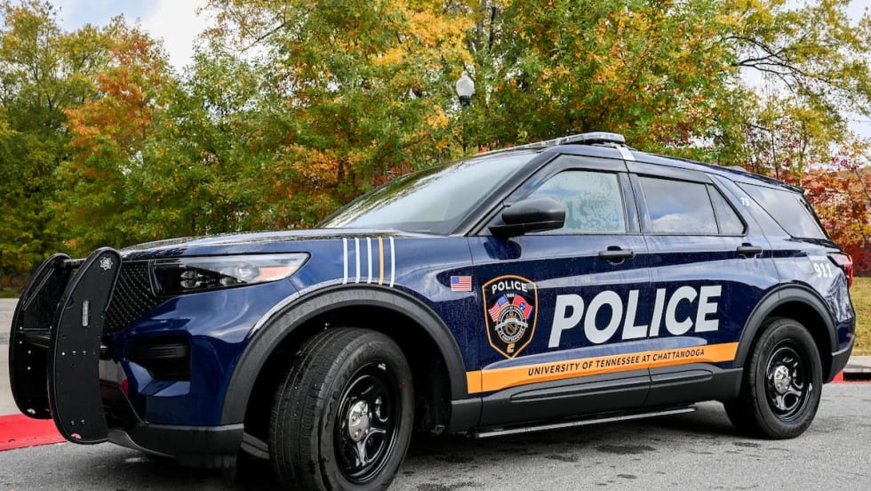 University of Tennessee at Chattanooga Police SUV parked outdoors, displaying updated blue-and-gold graphics, police markings, and university identification.
